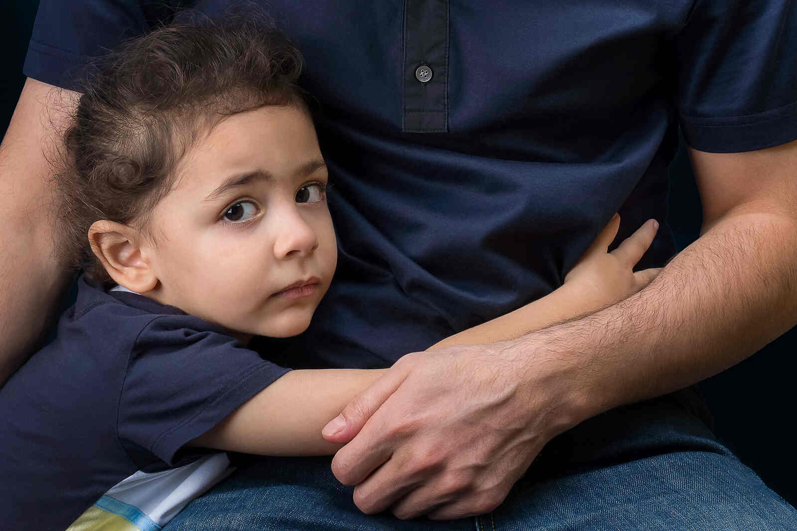 A child hugging her father, symbolizing the importance of paternity testing and child support in FL.