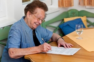 Elderly Woman Doing Paperwork